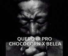 a black and white photo of a man praying with the words " quero ir pro chococorn x bella " below him