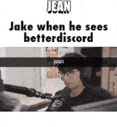 a man wearing headphones and glasses is sitting in front of a microphone and says jean when he sees better discord
