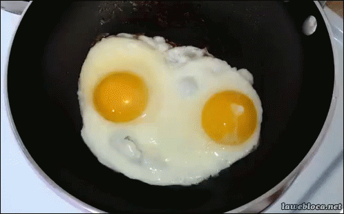 blowing a fried egg out of a frying pan