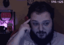 a man with a beard is wearing headphones and a shirt that says read