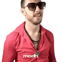 a man wearing sunglasses and a red shirt says mcdh