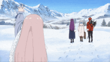 a group of people are standing in the snow looking at a mountain