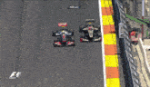 two race cars on a track with the word replay on the bottom right