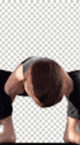 a man is doing a yoga pose with his head down on a white background .