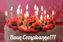 a birthday cake with many lit candles and the words buon compleanno !!!