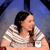 a woman in a striped shirt is smiling and the words vex devious are above her