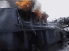 a house is burning with smoke coming out of the windows