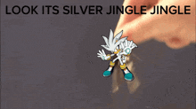 a cartoon of silver the hedgehog with the words look its silver jingle jingle behind him