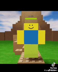 a yellow and blue roblox character with a smile on his face is standing in front of a pyramid .