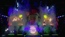 a tnt logo is projected on a large screen