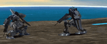 two robots are standing next to each other on a beach