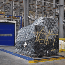 a warehouse with uldwsog written on a sign
