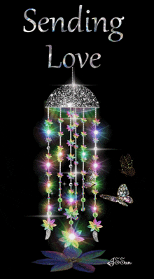 a greeting card that says sending love with a wind chime