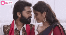 a man and a woman are kissing each other in a movie .