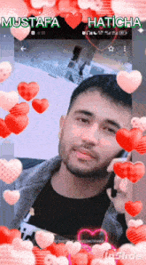 mustafa haticha is surrounded by hearts on a screen