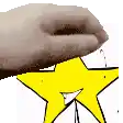 a hand is holding a yellow star on a white background