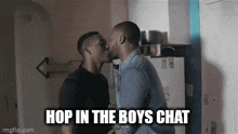 two men are kissing in a kitchen with the words `` hop in the boys chat '' written above them .