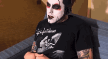 a man is wearing a shirt that says ' nightmare stalkers ' on it