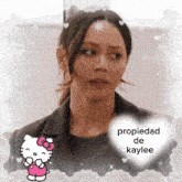 a picture of a woman with a hello kitty and the words propiedad de kaylee on it