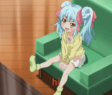 a girl with blue hair is sitting on a green chair and the word hi is on the bottom