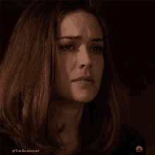 a close up of a woman 's face with #theblacklist on the bottom