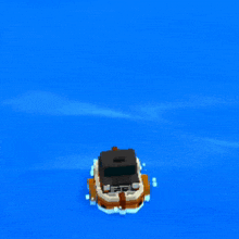 a small boat is floating in the water near a building