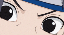 a close up of a person 's eyes with a blue band around their head