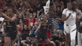 a basketball game is being played and the indiana team is celebrating