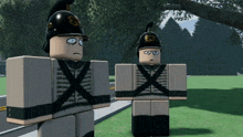 two toy soldiers are standing next to each other with one wearing a helmet with the letter x on it
