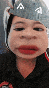 a person wearing a hat with a smiley face on it