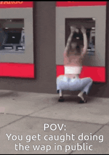 a woman is kneeling in front of an atm machine with the caption " you get caught doing the wap in public "