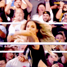 a woman is dancing in front of a crowd with the hashtag #thenextbigthings