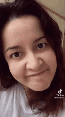 a close up of a woman 's face with the hashtag tiktok