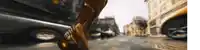 a blurred image of a city street with a car driving down it