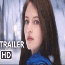a close up of a woman 's face with the words trailer hd above her .
