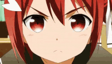 a close up of a girl with red hair