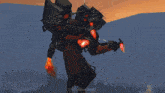 a man is standing in front of a robot that is shooting red lasers at him .