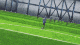 a soccer player in a blue uniform is kicking a soccer ball