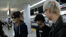 a man wearing a black shirt that says aion