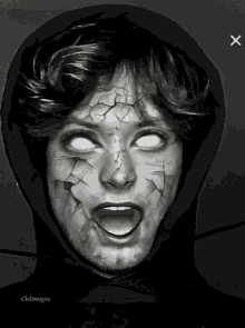 a black and white photo of a person with white eyes and cracked face