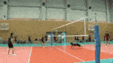 a volleyball game is being played on a court with a tbs logo in the corner