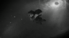 a black and white photo of a person flying in the air