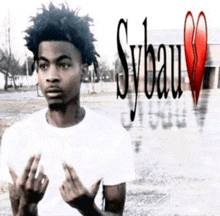 a young man in a white shirt is giving the middle finger and has a broken heart in the background .