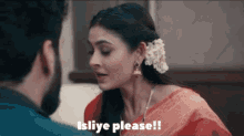 a woman in a red saree is talking to a man with the words isliye please written above her