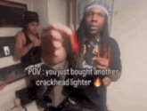 a man is holding a crackhead lighter in his hand while standing next to another man .