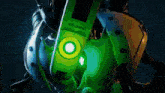 a close up of a green object with a yellow light on it