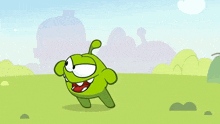 a green cartoon character with a red mouth is standing in a field