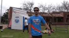 a man wearing a blue shirt that says " how ridiculous "