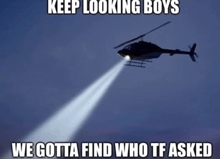 a picture of a helicopter with a light coming out of it that says keep looking boys
