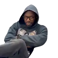 a man wearing a hoodie and glasses looks angry